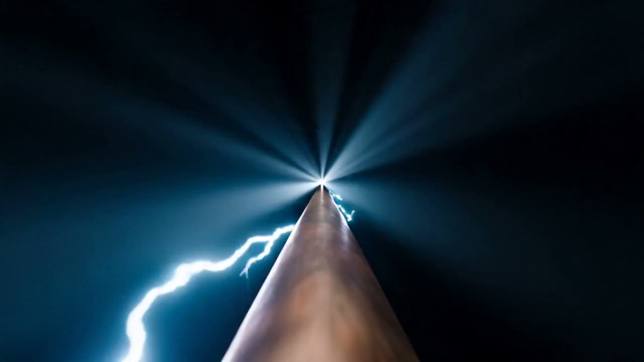 Electric current arcing along a copper wire in blue light